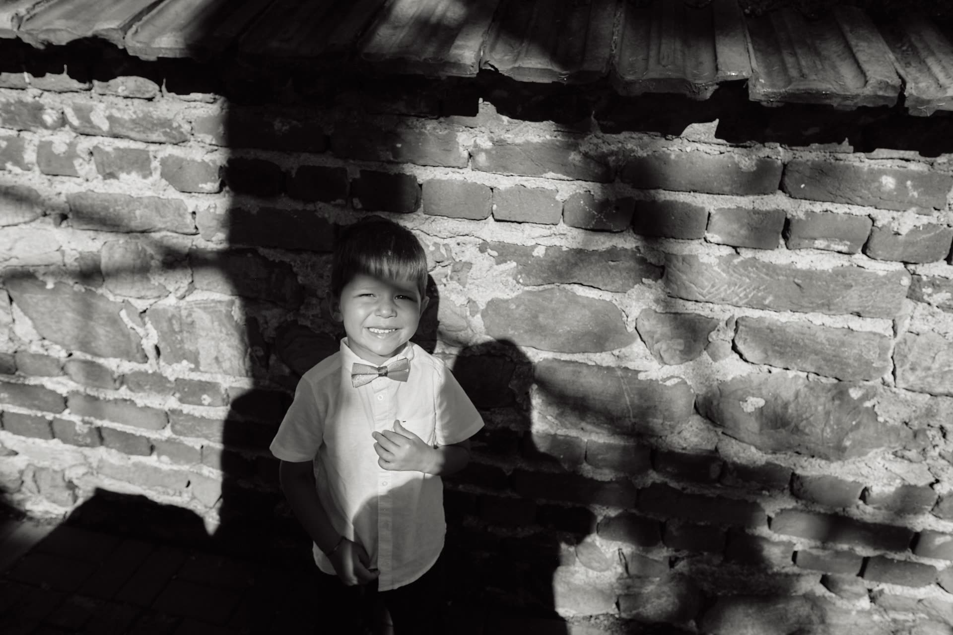 Child caught in a quiet black and white moment